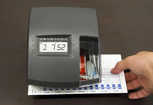 California worker reviewing pay records to identify misclassification and wage violations